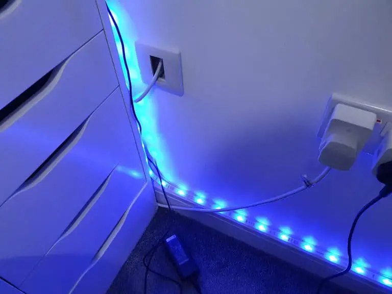 A smart light strip Hue Lightstrip Plus set to a blue color