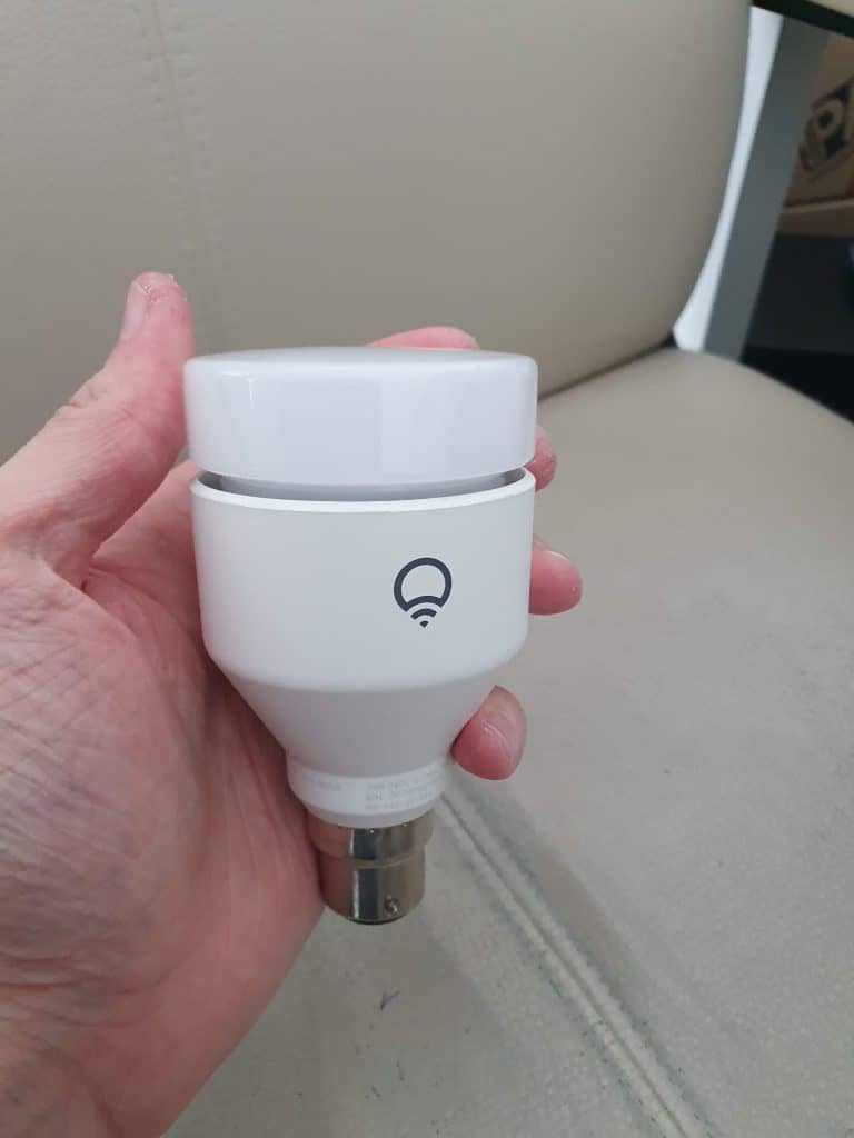 Me holding a LIFX full color smart bulb