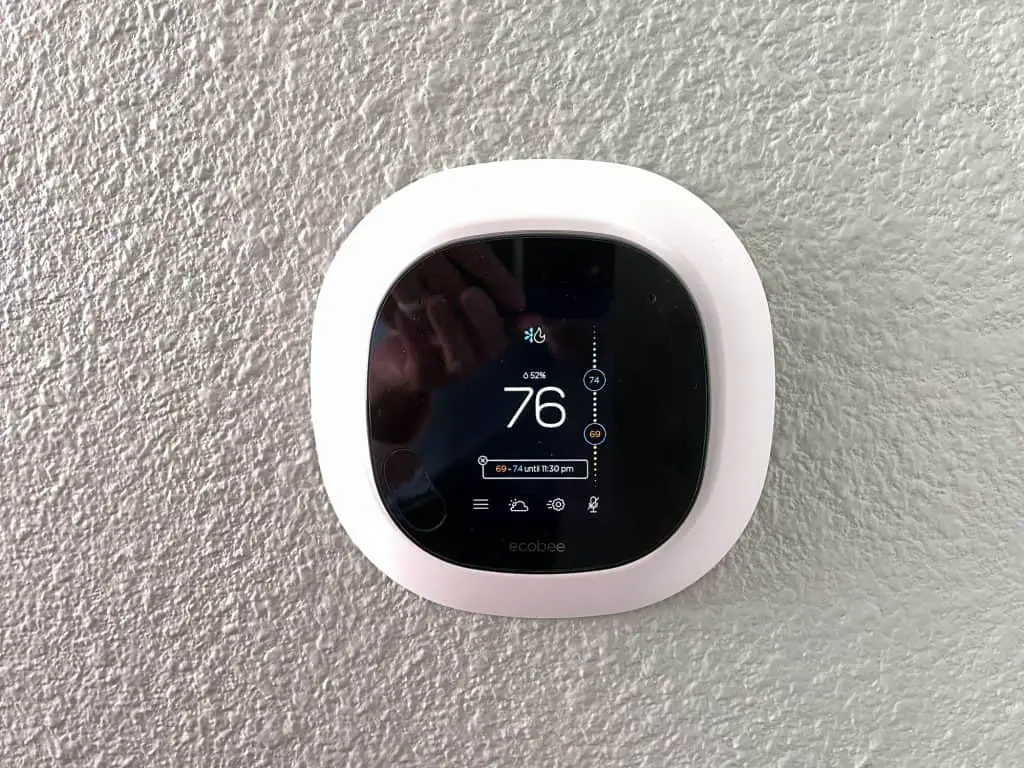 An Ecobee smart thermostat mounted on a wall