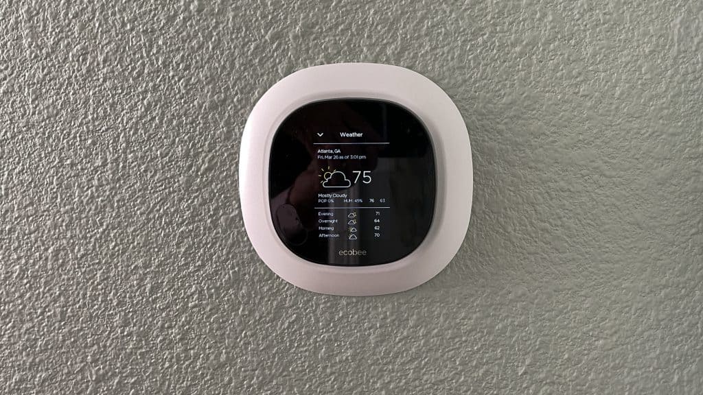 An ecobee smart thermostat showing the current and expected weather